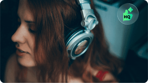 A vocalist wearing headphones while listening to music